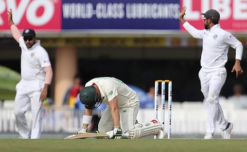 South Africa's Dean Elgar, center, reacts in pain after being hit on a delivery by India's Umesh Yadav. (Photo | AP)