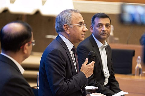 CEO Salil Parekh, center, and CFO Nilanjan Roy, right. (Photo | Karen Dias, Bloomberg)