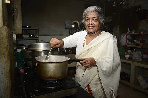 Sarojaniyamma in the kitchen making food. (Photo | Manu R Mavelil, EPS)