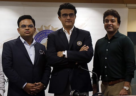 Newly-elected President of the Board of Control for Cricket in India (BCCI) Sourav Ganguly, center, Secretary Jay Shah, left, and Treasurer Arun Dhumal stand for a photograph during a press conference in Mumbai. (Photo | AP)