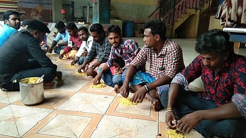 The fans, aged 20 to 35 years, ate tamarind rice they served themselves on the floor. ( Photo | EPS )