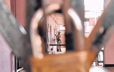 Security personnel guarding the strong rooms in which the electronic voting machines of the Vattiyoorkavu byelection are kept at St Marys HSS, Pattom in Thiruvananthapuram.The counting will take place on Thursday| B P Deepu