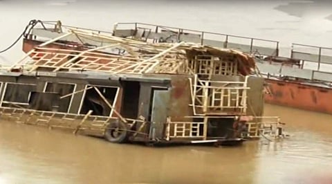 Royal Vasishta boat seen in damaged condition which war brought to river surface from the river bed at Kacchuluru manda on Tuesday| Express