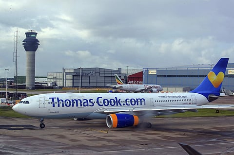 A Thomas Cook plane taxis on the runway at terminal one of Manchester Airport, England. (File Photo | AP)