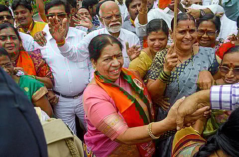 Navi Mumbai BJP candidate Manda Mhatre celebrates with supporters after her win in Maharashtra State Assembly elections at Agri Koli Bhavan Nerul in Navi Mumbai. (Photo | PTI)