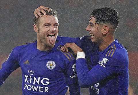 Leicester's Jamie Vardy, left, celebrates with Ayoze Perez after scoring his side's fifth goal. (Photo | AP)