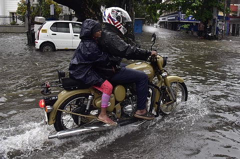 Motorists had a tough time in waterlogged roads of Kochi after continuous rains hit the city. (Photo | Albin Mathew, EPS)