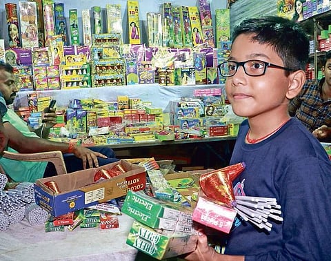 A child buying crackers on the eve of Diwali in Bhubaneswar on Saturday| Ifrana