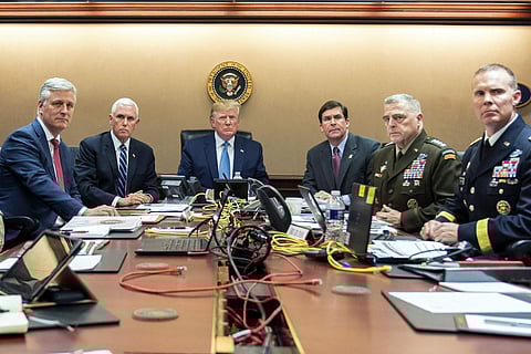 In this photo provided by the White House, President Donald Trump is joined by from left, national security adviser Robert O'Brien, Vice President Mike Pence, Defense Secretary mark Esper, Joint Chiefs Chairman Gen. Mark Milley and Brig. Gen. Marcus Evans