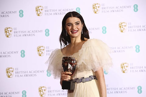 Actress Rachel Weisz poses for photographers backstage with her Best Supporting Actress award for her role in the film 'The Favourite' at the BAFTA awards. (AP photo)