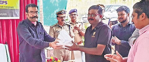 Rishiraj Singh, DGP of Prisons and Correctional Services, handing over a ‘Food for Freedom’ combo to a Swiggy official