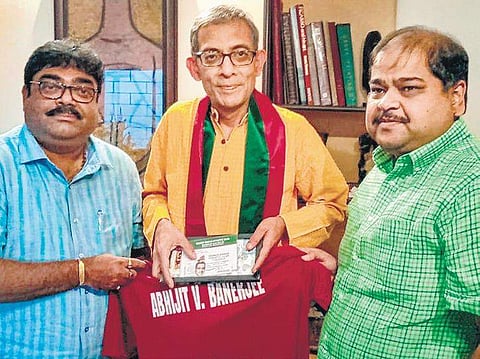 Srinjoy Bose (R), assistant general secretary and Debasish Dutta (L), finance secretary, Mohun Bagan Athletic Club meet Nobel laureate Abhijit Banerjee to offer him lifetime membership of the club, in Kolkata on Wednesday | Pti