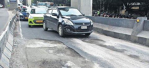 Commuters are in for a bumpy ride on the Tarnaka flyover in Hyderabad, which has been ridden with potholes ever since the monsoon began this year | Sathya Keerthi