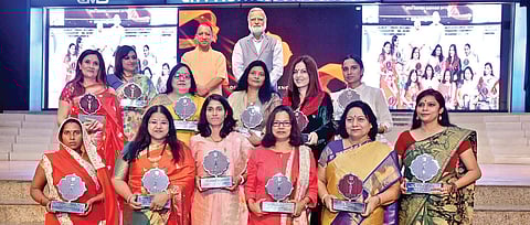 Uttar Pradesh Chief Minister Yogi Adityanath and The New Indian Express Group Editorial Director Prabhu Chawla with the Devi Award winners in Lucknow on Wednesday (Photo courtesy| CMS)