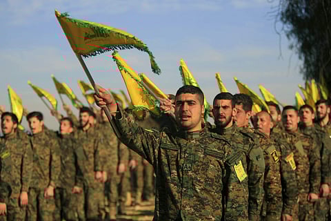 Hezbollah fighters with their flags (File | AP)