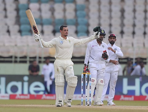 South Africa's Quinton de Kock raises his bat after scoring his century (Photo | AP)