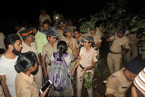 People enter in to the metro car shed on the spot during tree cutting at Aarey colony in Mumbai late Friday Oct 4 2019. | (Photo | PTI)