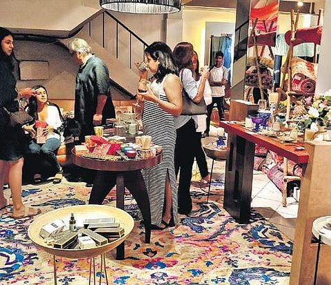 A game of wooden blocks by Portside Cafe; visitors at the Niana stall