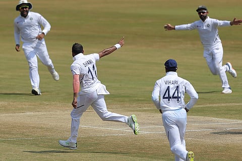 Indian bowler Mohammed Shami, with out cap, celebrates after dismissing South Africa's Quinton de Kock. (Photo | AP)