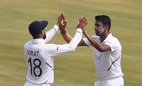 India's Ravichandran Ashwin celebrates with captain Virat Kohli after dismissing South Africa's Keshav Maharaj on the fourth day of the first cricket test match at Dr YS Rajasekhara Reddy ACA-VDCA Cricket Stadium in Visakhapatnam (Photo| PTI)
