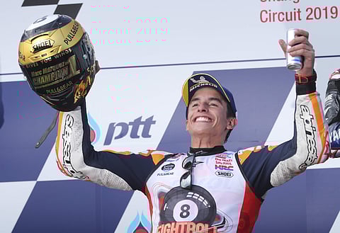 Spain's rider Marc Marquez of the Repsol Honda Team celebrates after winning Thailand's MotoGP and his 8th Moto GP Championship at the Chang International Circuit in Buriram. (Photo | AP)