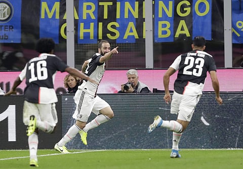 Juventus' Gonzalo Higuain, centre, celebrates after scoring his side's second goal. (Photo | AP)