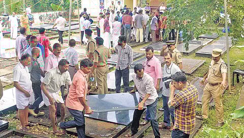 Police exhuming bodies of the family members who died under mysterious circumstance, from their graves at Koodathayi. (Photo | EPS)
