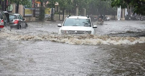 A car on a flooded road in Hyderabad on Sunday. The city has been experiencing heavy rains for past few days |Vinay Madapu