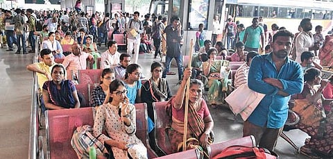 People waiting for buses at Pandit Nehru Bus Station in Vijayawada on Sunday | EXPRESS
