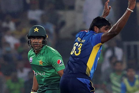 Pakistani batsman Umar Akmal, left, looks to umpire while Sri Lankan pacer Nuwan Pradeep appeals for his dismissal. (Photo | AP)
