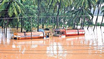 Trucks submerged in Karnataka flood water (File Photo |EPS)