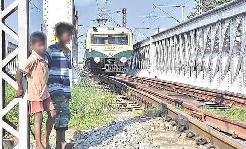 Boys standing near tracks when a train was approaching Korukkupet - Basin Bridge section on Tuesday | Ashwin Prasath