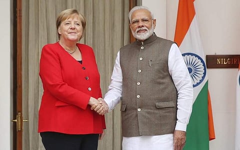 German Chancellor Angela Merkel (L) with PM Narendra Modi (Photo| Shekhar Yadav/ EPS)