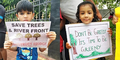 Kids hold placards at “Save Tree and Riverfront” campaign in Guwahati on Sunday (Photo | Express)