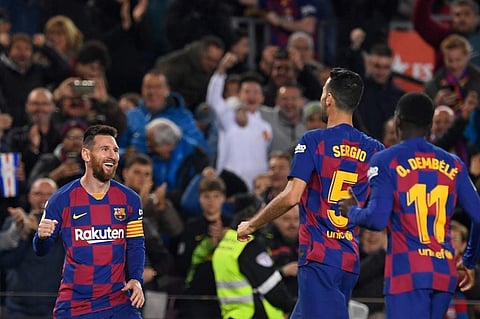 Barcelona's Argentine forward Lionel Messi (L) celebrates after scoring during the Spanish league football match between FC Barcelona and RC Celta de Vigo at the Camp Nou stadium in Barcelona. (Photo | AFP)