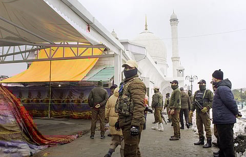 Security personnel stand guard during celebration of Eid-e-Milad-un-Nabi at Dargah Hazratbal in Srinagar. (photo | PTI)