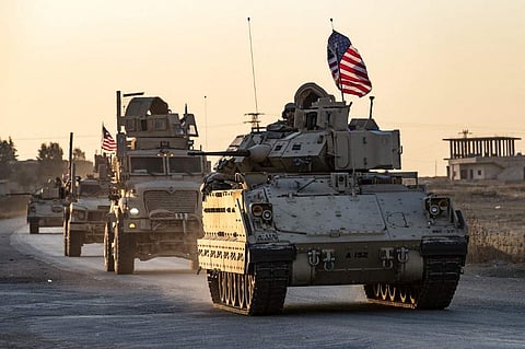 A convoy of US military vehicles drives near the town of Tal Tamr in the northeastern Syrian Hasakeh province on the border with Turkey, on November 10, 2019. (Photo | AFP)