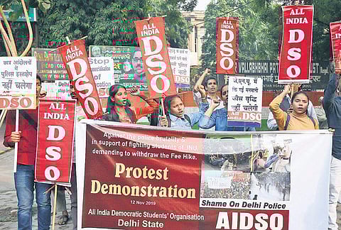 Members of All India Democratic Students’ Organisation shout slogans as they protest the Delhi Police action against the agitating Jawaharlal Nehru University students, in New Delhi on Tuesday; (