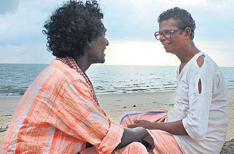 Mani sharing a light moment with Indrans in a scene from the film 'Udalaazham'