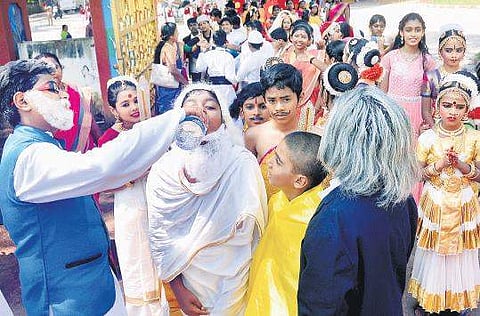 Children dressed as Amitabh Bachan, A P J Abdul Kalam quench their thirst after participating in the rally held as part of Children’s Day celebrations in the city| Vincent Pulickal