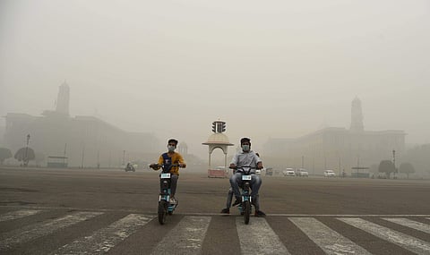 Children wear mask to protect themselves from pollution as a the air quality dips to ‘very poor’ category, in New Delhi. (Photo | Parveen Negi, EPS)