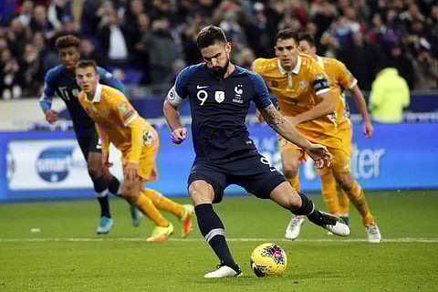 France's Olivier Giroud scores a penalty during the Euro 2020 group H qualifying soccer match between France and Moldova at the Stade de France stadium, in Saint Denis, north of Paris, Thursday, Nov. 14, 2019.