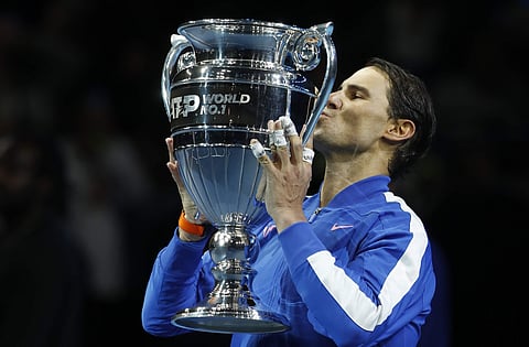 Spain's Rafael Nadal lifts the ATP World Number 1 trophy following the presentation on court after his match against Stefanos Tsitsipas of Greece. (Photo | AP)