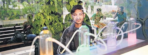 A Delhiite sits at an oxygen bar which offers “pure oxygen” to its customers in different aromas, in Saket. (Photo | Shekhar Yadav)