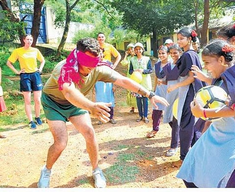 Inmates of juvenile home for girls playing sports with US armed forces personnel during their visit on Friday