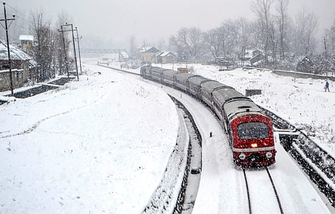 A train trails on a snow-covered Srinagar-Banihal railway track following fresh snowfall in Anantnag taken on 13/12/2018. (File Photo | PTI)