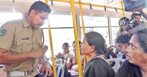 Police verifying the age of two women devotees who were proceeding to Pampa from Nilakkal in a KSRTC bus on Sunday| A Sanesh