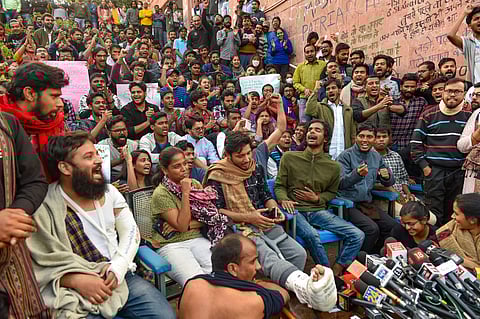 JNU students and their leaders who got injuries in Monday's police lathicharge shout slogans during a press conference at the university campus in New Delhi Tuesday Nov 19 2019. (Photo | PTI)