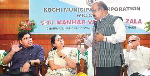 National Commission for Safai Karamcharis chairman Manhar Valij Bhai Zala holding a district-level meeting at the corporation council hall. District Collector S Suhas and Mayor Soumini Jain are also seen | Express