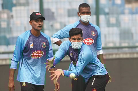 Bangladesh cricket team members wear masks to protect themselves from air pollution as they practice at the nets ahead of their first T20 international cricket match against India in New Delhi. (Photo | AP)